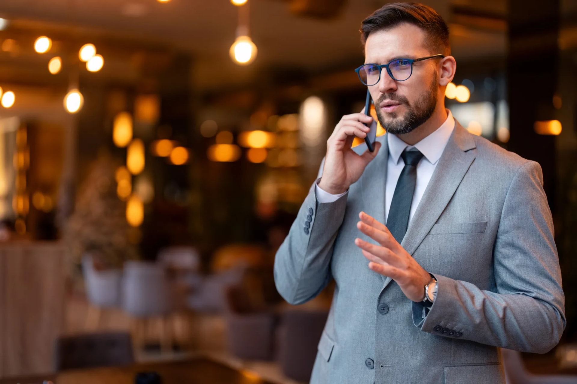 Business owner taking a customer call in a hospitality venue