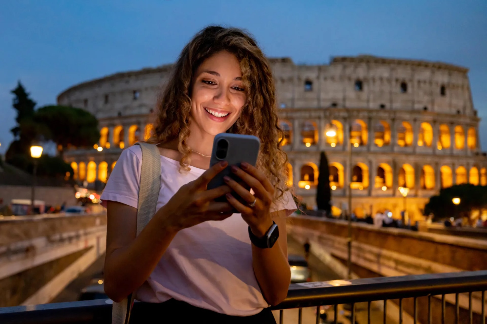 Traveler using her phone while visiting a city abroad