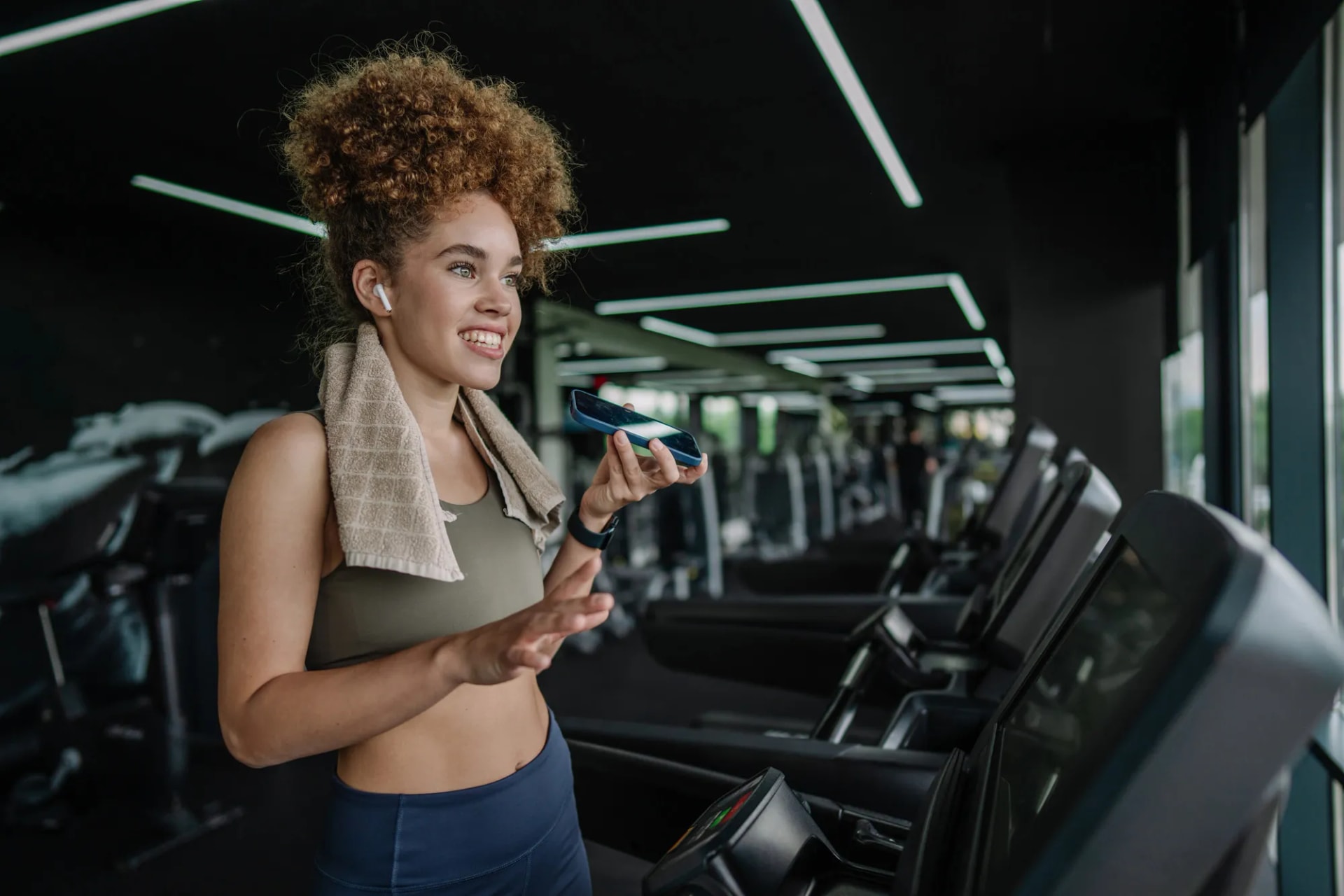 Personal trainer on the phone in her gym studio