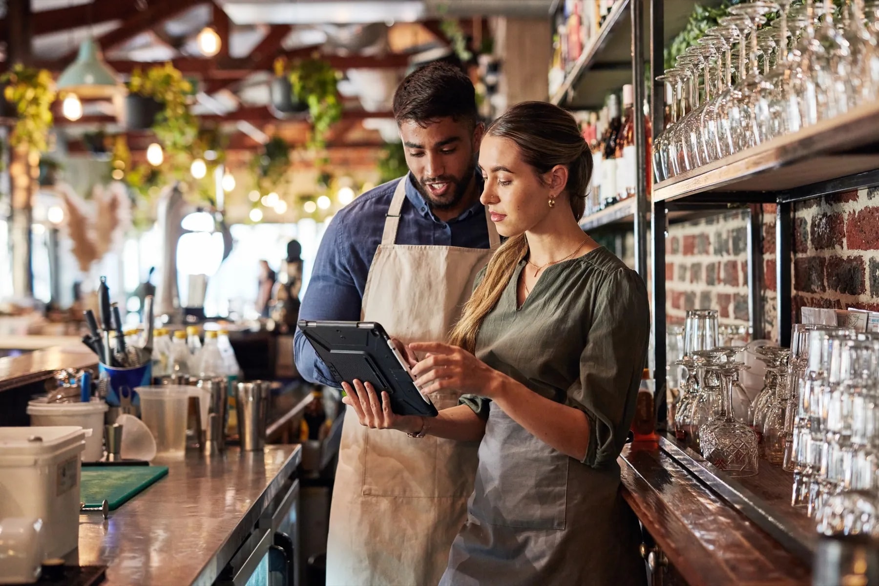 Cafe managers checking customer orders behind the counter