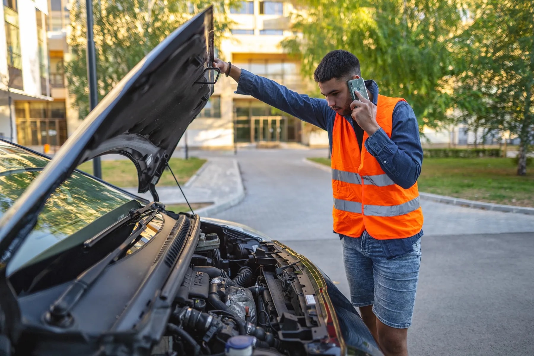 Roadside service technician answering a customer call