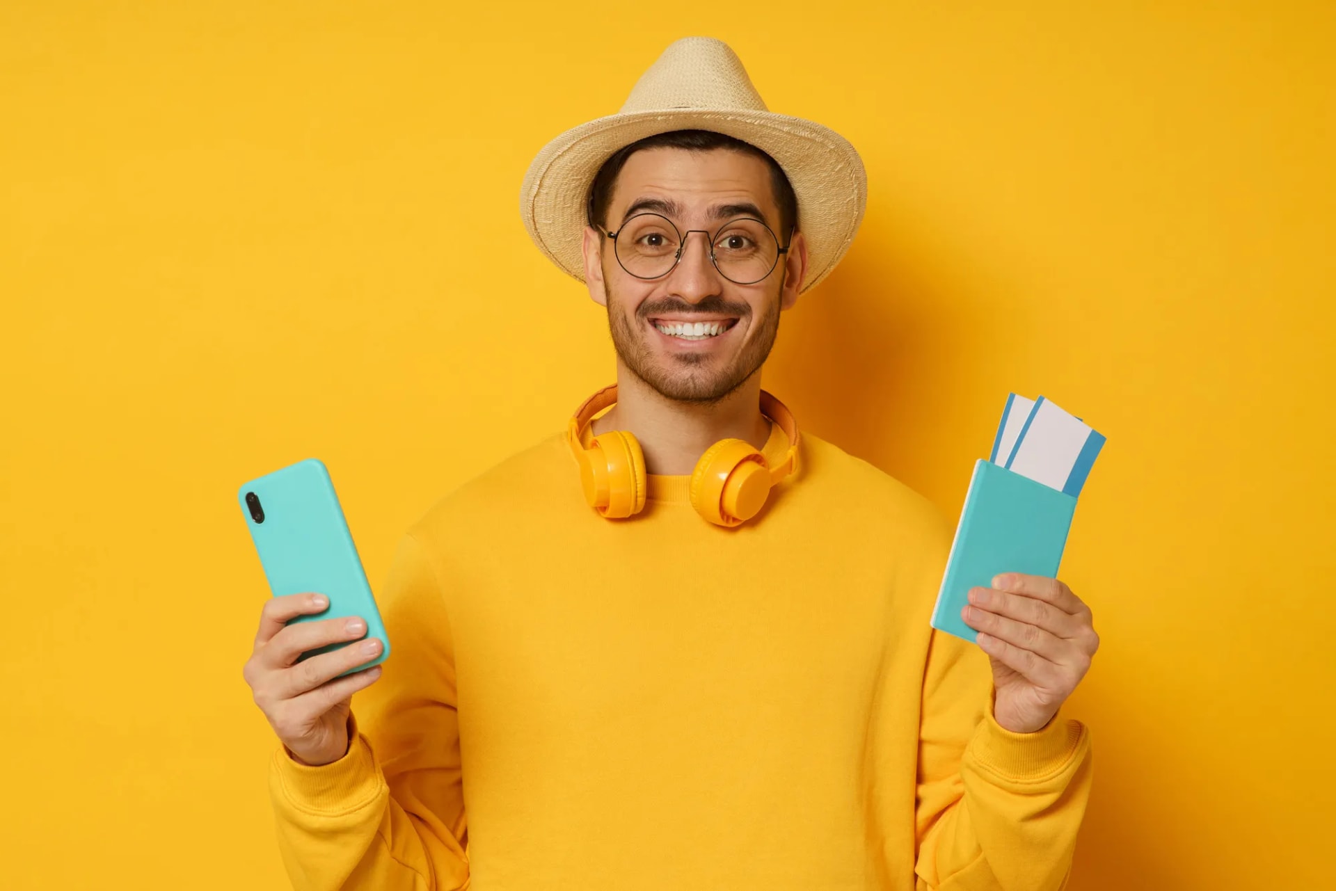 Traveler holding a passport and phone between flights