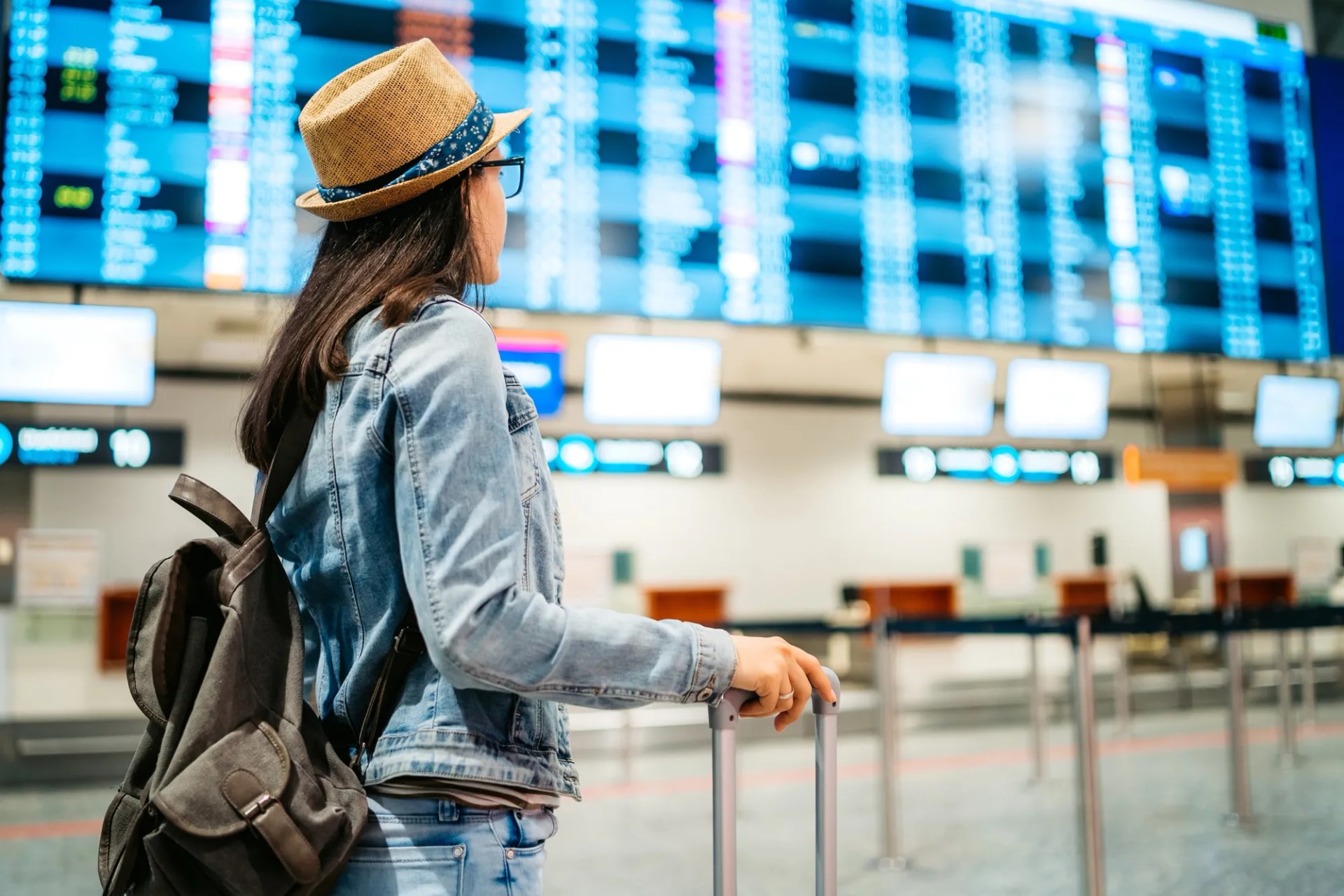 Traveler checking airport departures