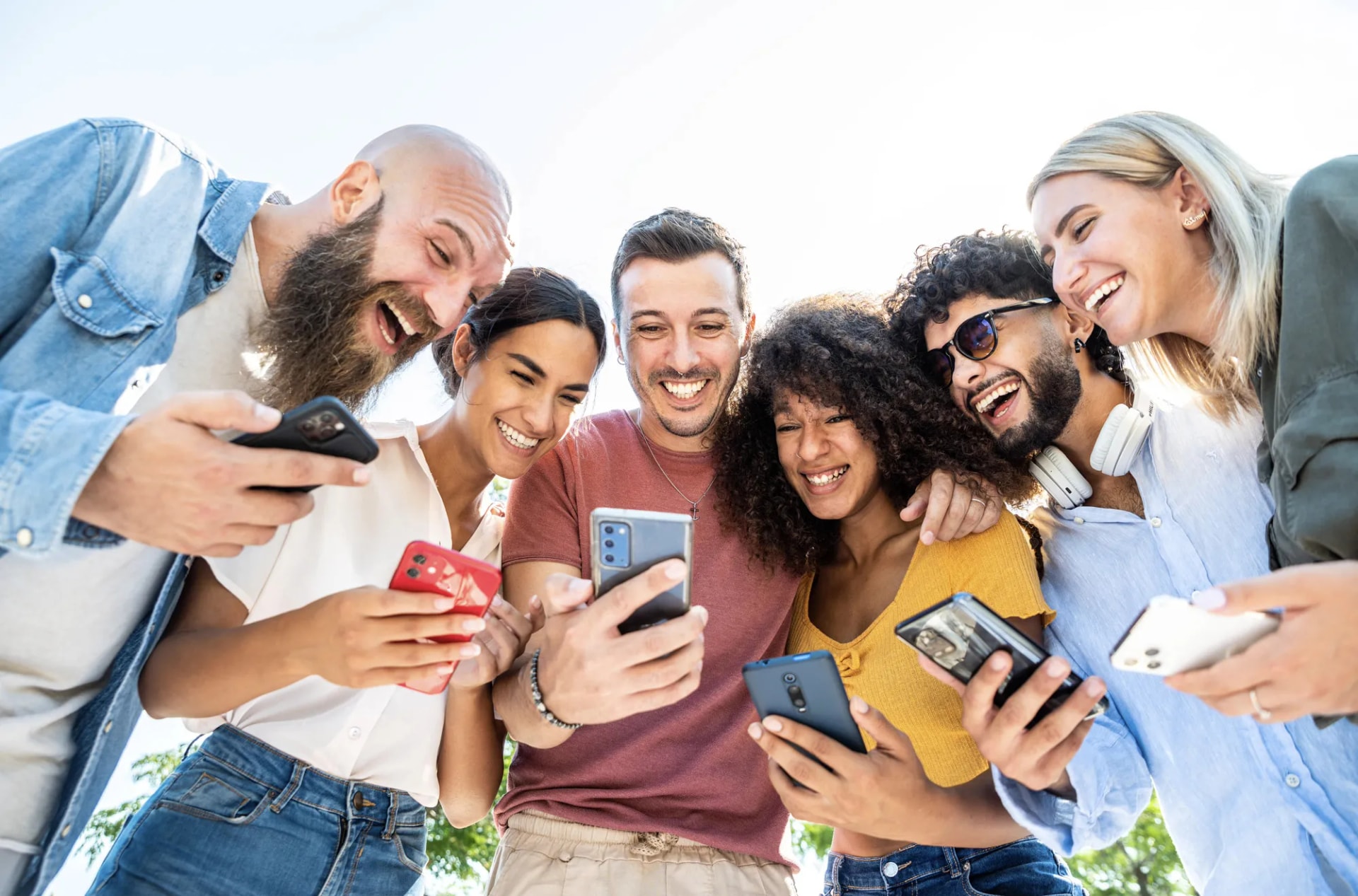 Friends looking at phones together