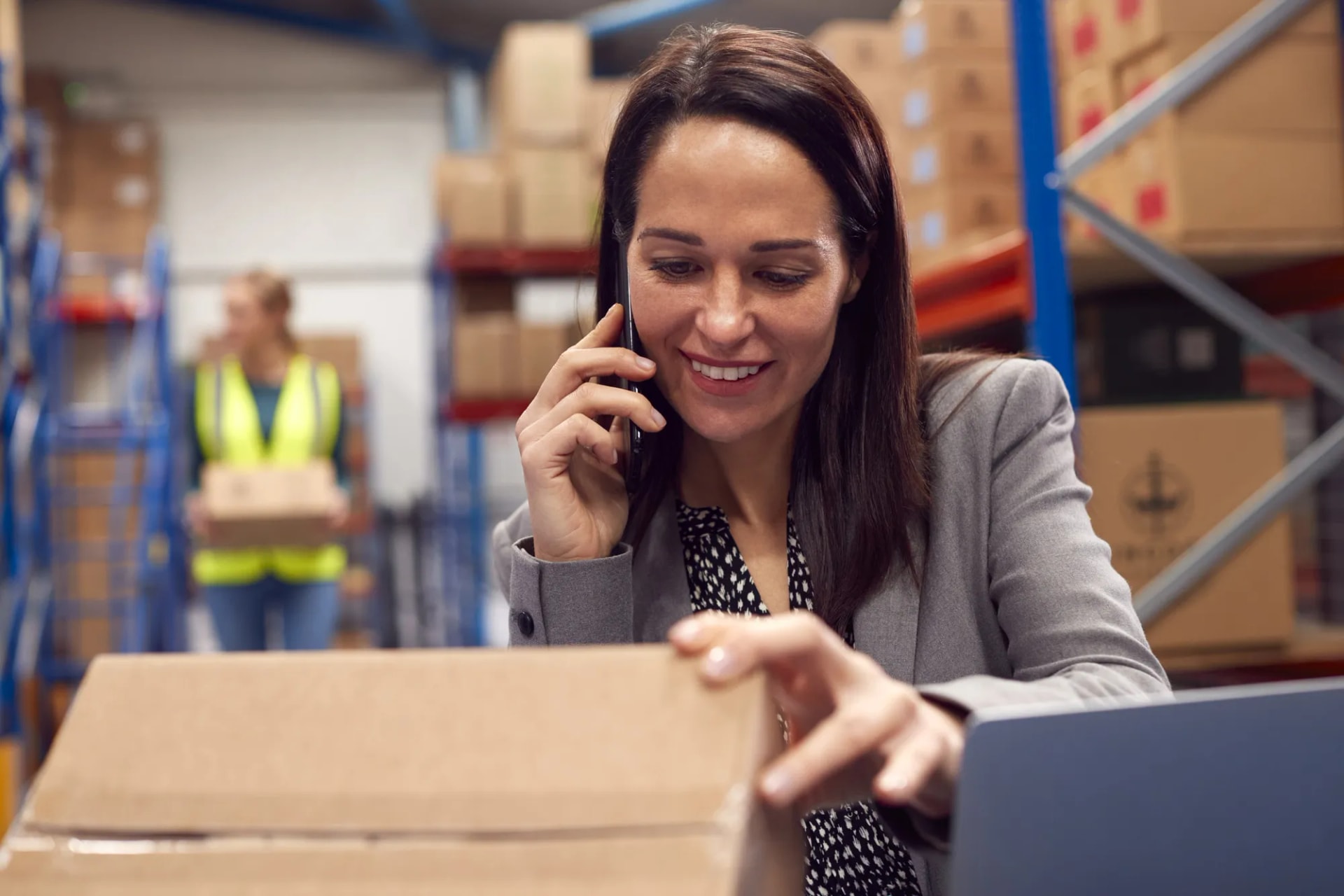 Person taking a phone call while working near parcel shelves