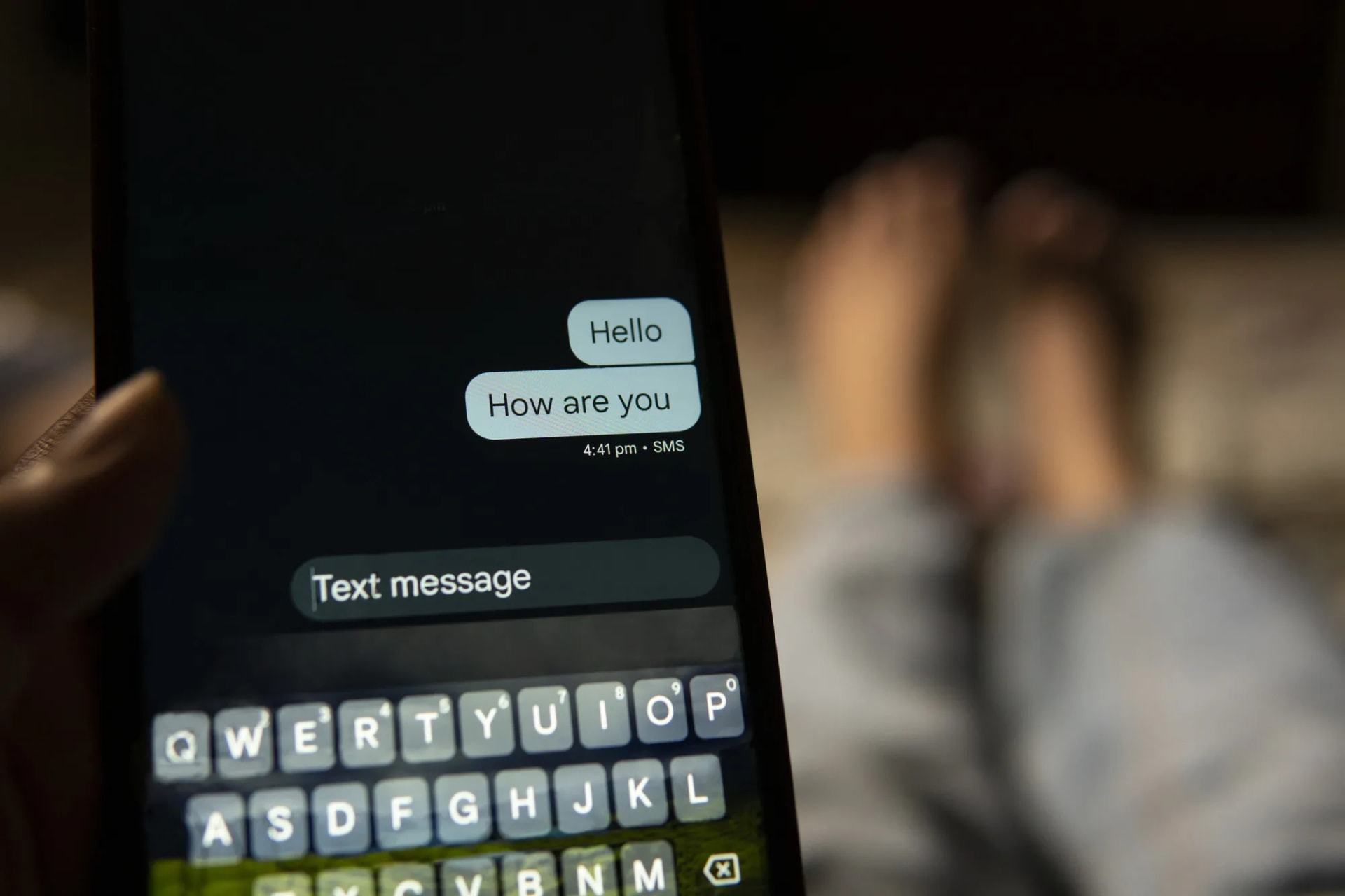 Close up of a text message being typed on a phone